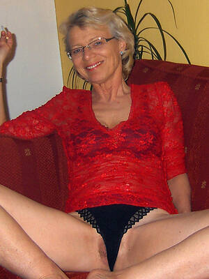 glum hot mature with glasses posing nude